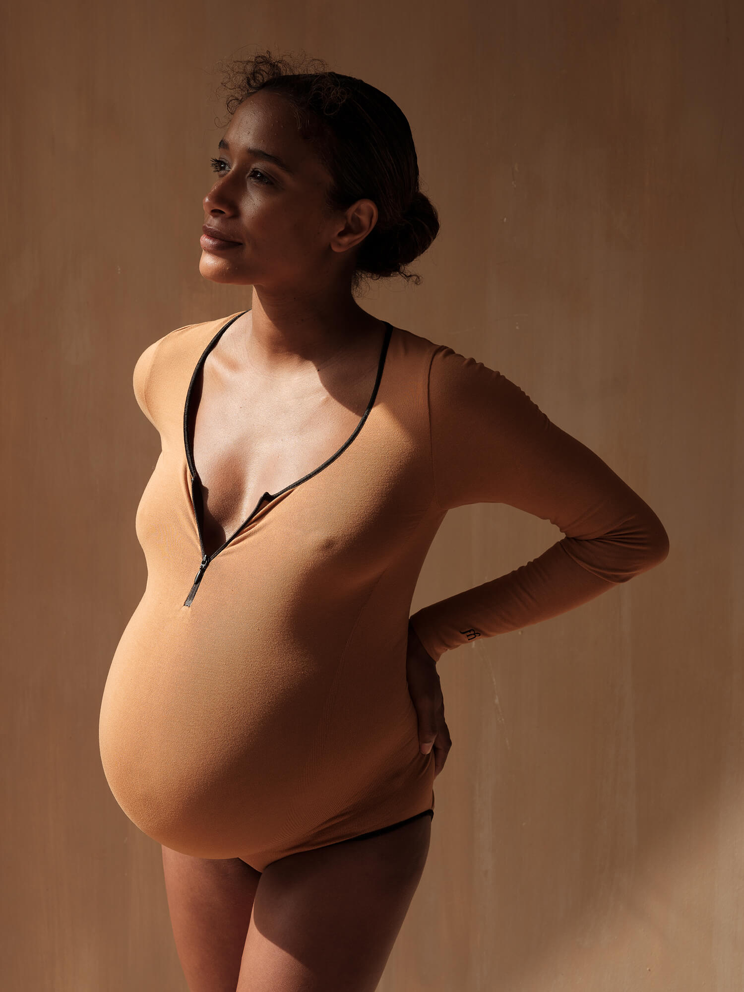 Jorgen House Hazel Neutral colour maternity bodysuit on pregnant female body