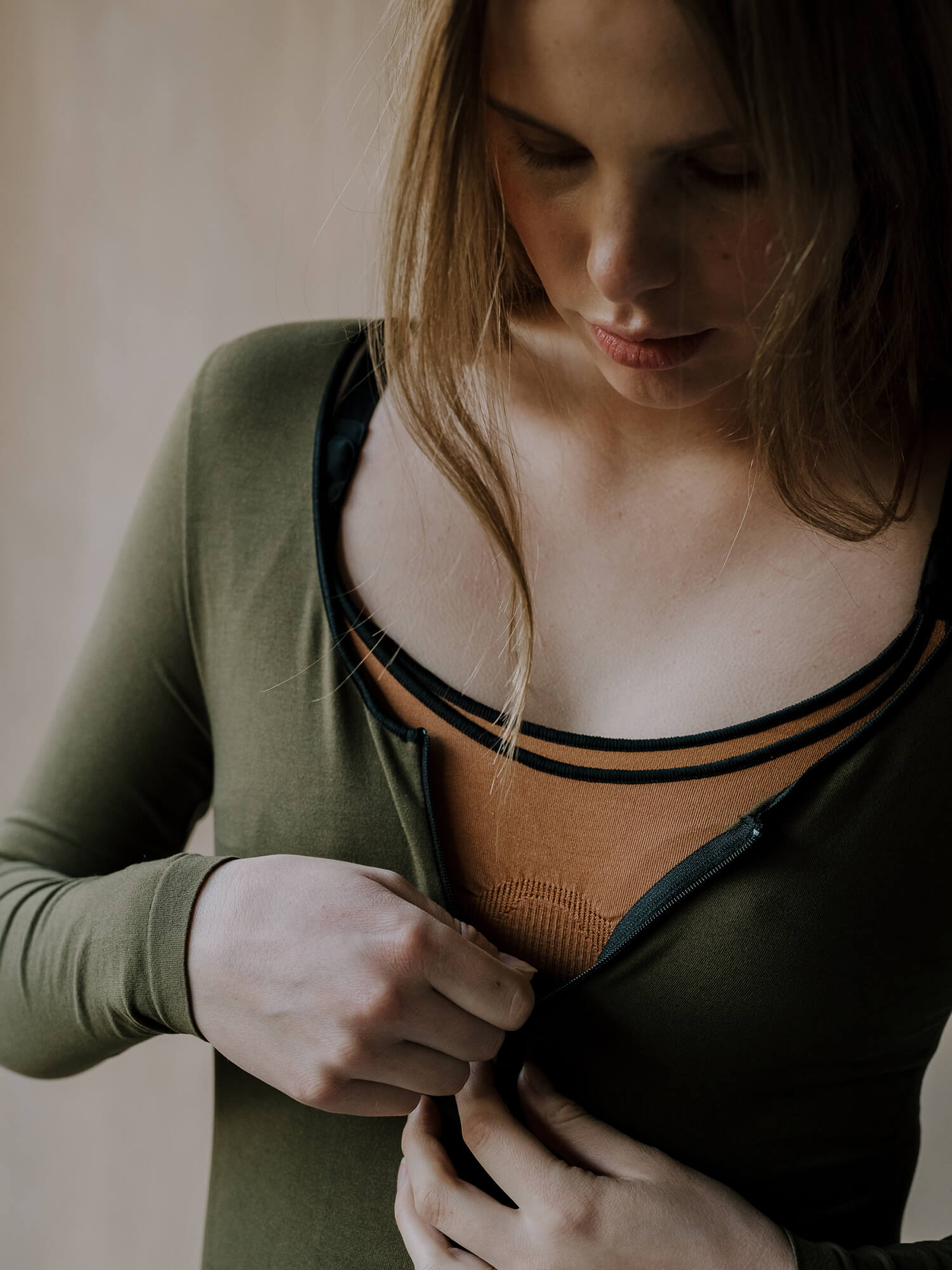 Jorgen House Dark olive green long sleeve bodysuit on female body