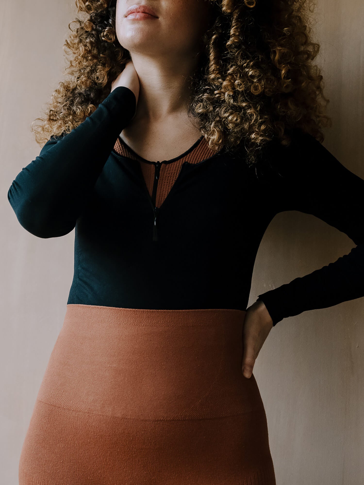Jorgen House Black long sleeve bodysuit and Ginger colour leggings on female body