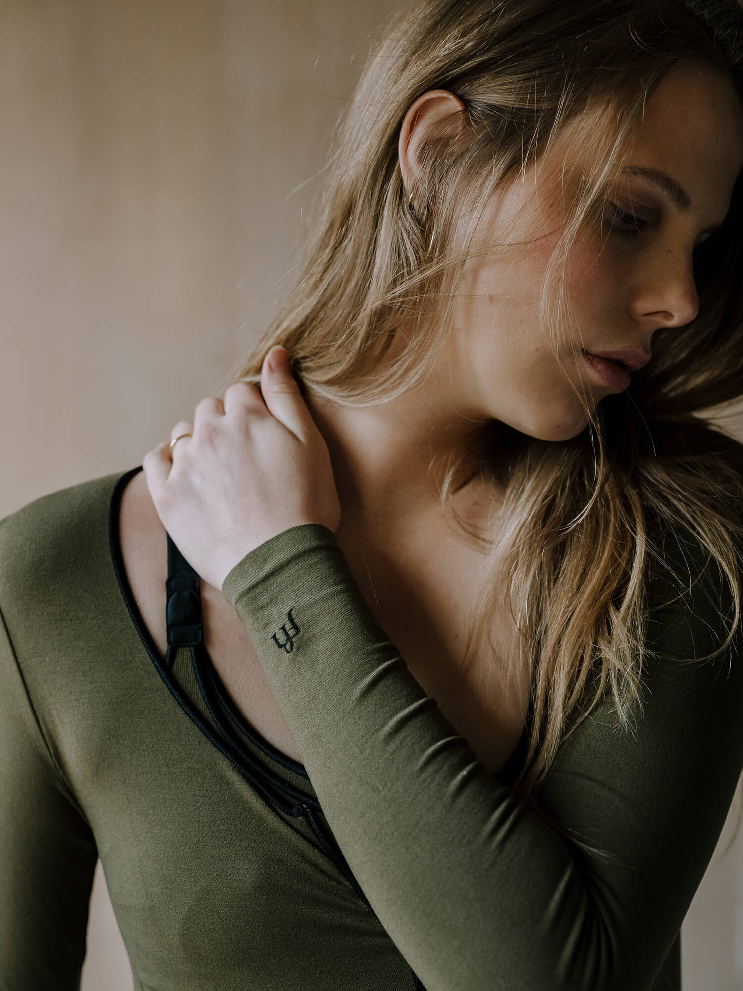 Jorgen House Dark olive green long sleeve bodysuit on female body