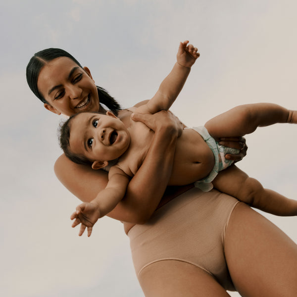 Mother and baby in movement wearing Jorgen House sand colour support briefs and bra