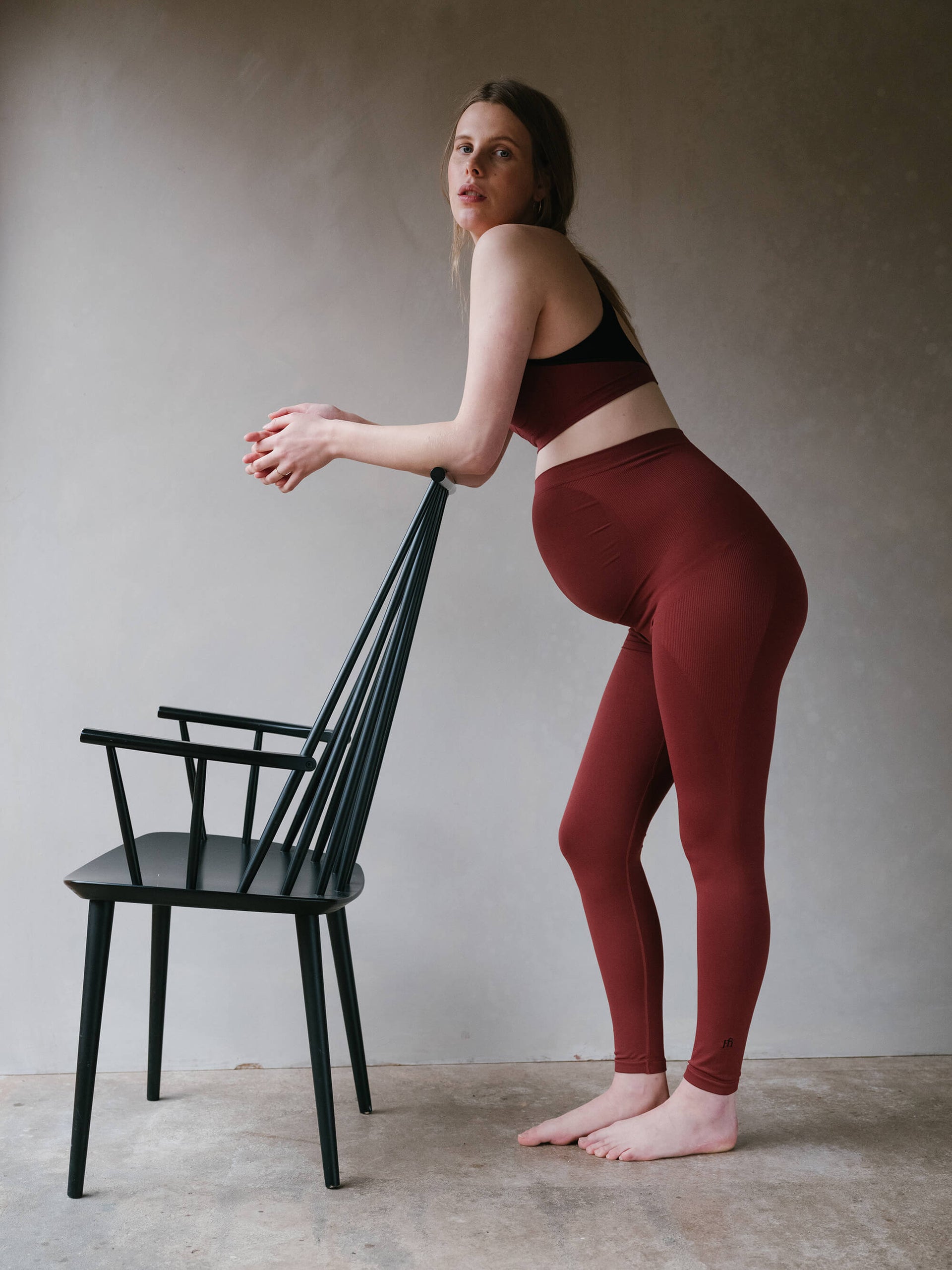 Jorgen House brick red maternity breastfeeding bra and high waist leggings on pregnant female body