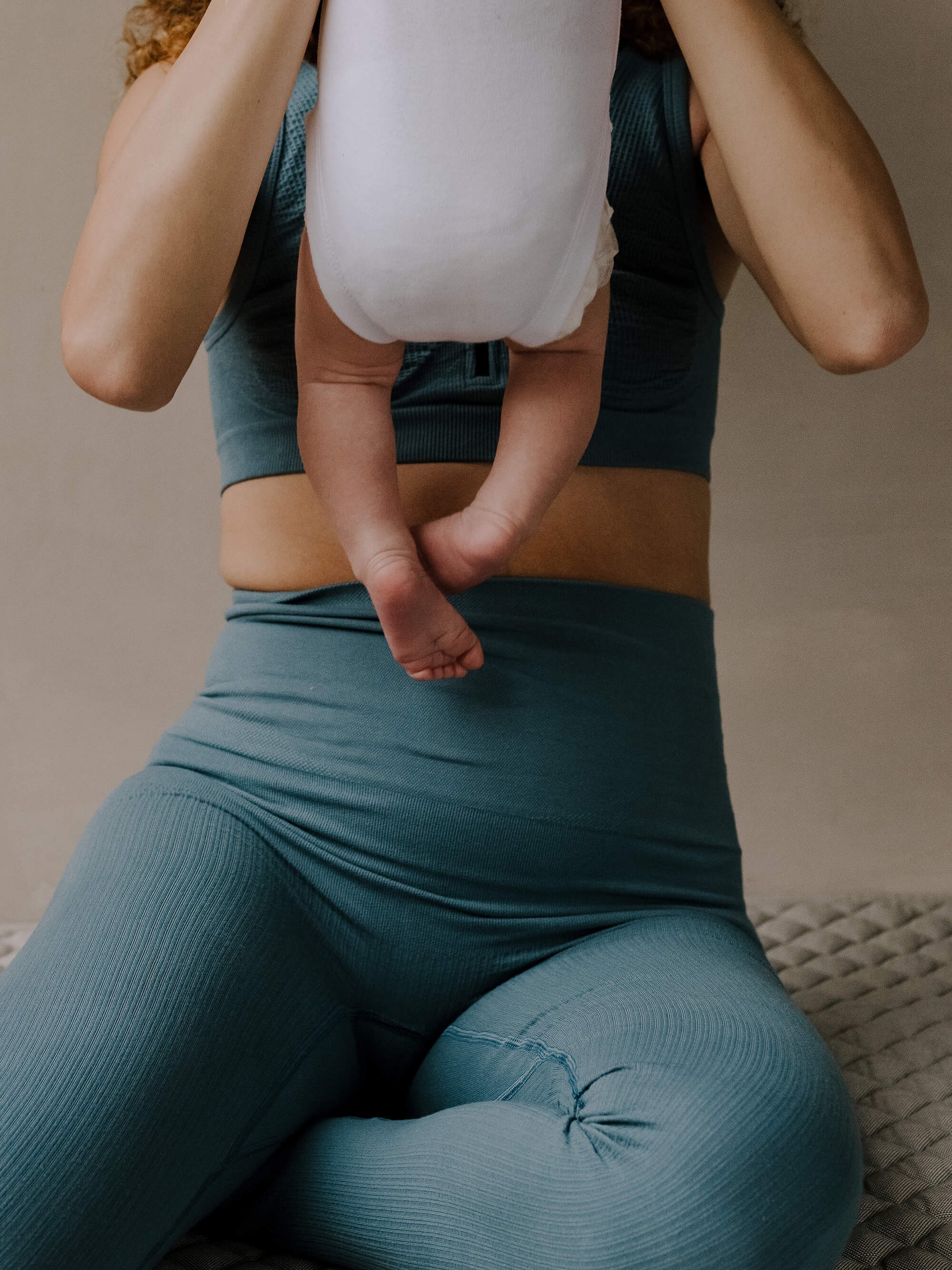 Jorgen House Blue colour high waist leggings on female body holding her baby